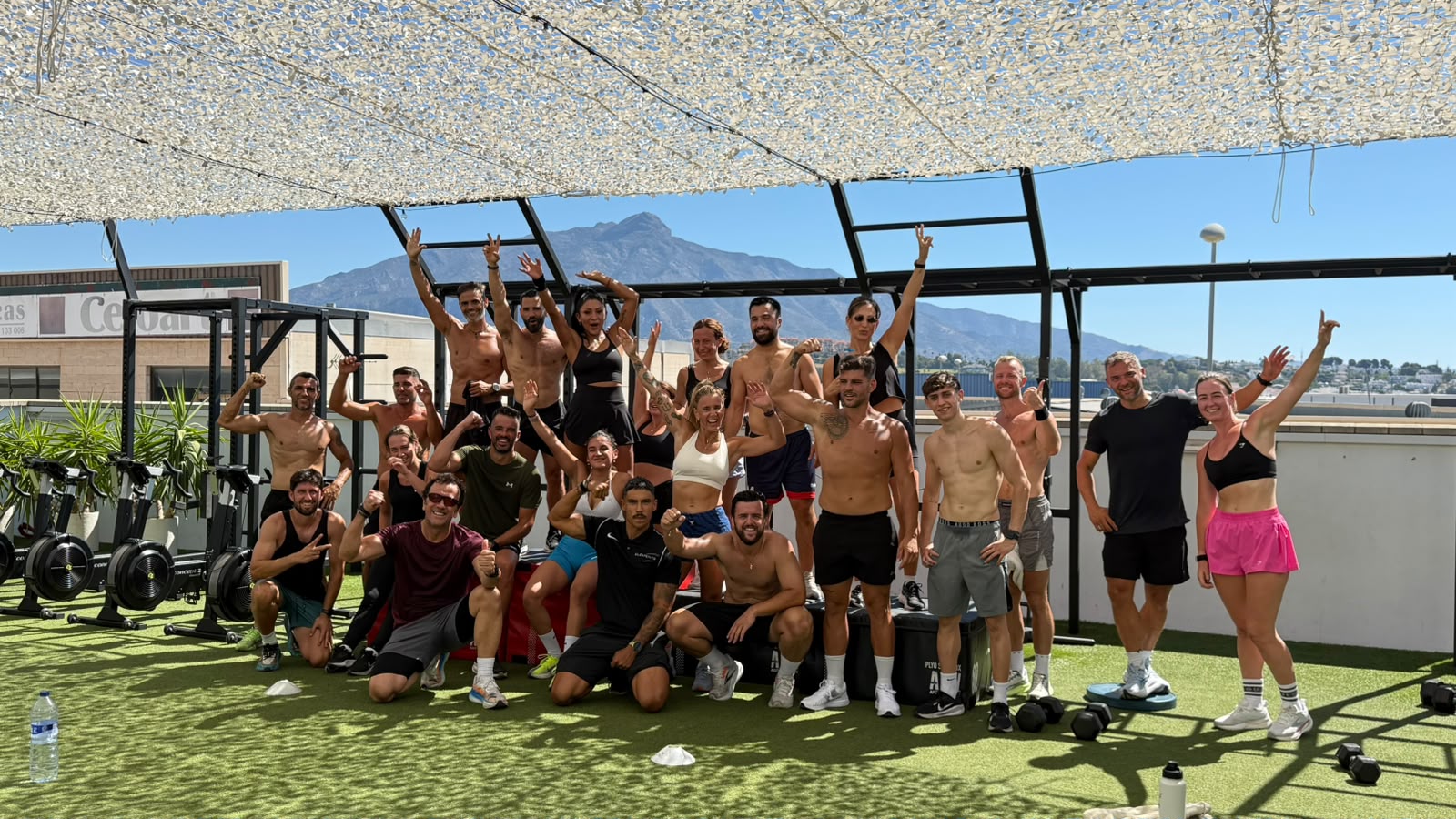 Elements Gym Marbella challenge group on the rooftop with La Concha in the background